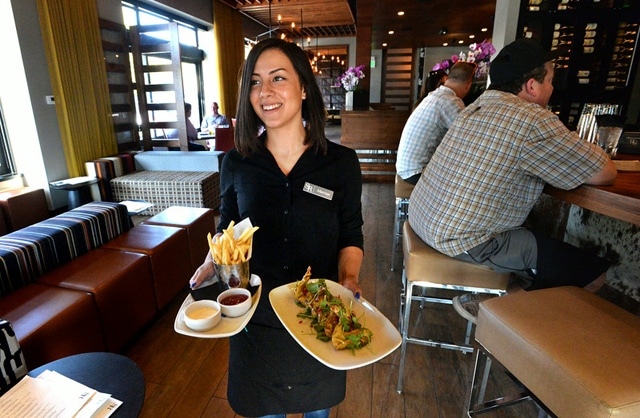 "Waitress Marissa Pier, of Antioch, carries appetizers to a table at the Sunol Ridge Restaurant & Bar in Walnut Creek, Calif., on Wednesday, Aug. 27, 2014. (Doug Duran/Bay Area News Group)"